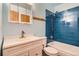 Clean bathroom with white vanity and blue tile at 9552 Field Ct, Broomfield, CO 80021