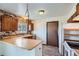 Galley kitchen with wood cabinets and ample counter space at 9552 Field Ct, Broomfield, CO 80021