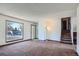 Spacious living room with large window and view of street at 9552 Field Ct, Broomfield, CO 80021