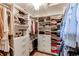 Large walk-in closet with ample shelving and drawers at 12044 Fontberry St, Parker, CO 80134