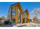 Contemporary duplex with wood and metal siding, and a welcoming front porch at 3829 Osage St, Denver, CO 80211