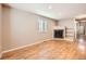 Living room with hardwood floors and a corner fireplace at 2256 S Dexter St, Denver, CO 80222