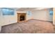 Finished basement with fireplace and carpet at 4482 S Argonne Ct, Aurora, CO 80015