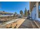 Wooden deck overlooks a backyard with pathway at 4482 S Argonne Ct, Aurora, CO 80015