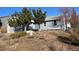 House exterior showcasing front yard and landscaping at 4482 S Argonne Ct, Aurora, CO 80015