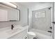 Updated bathroom featuring a bathtub, stylish tile, and modern vanity at 590 N Logan St # 210, Denver, CO 80203