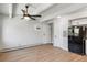Living room featuring hardwood floors and a ceiling fan at 590 N Logan St # 210, Denver, CO 80203