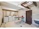 Shared laundry room with several washers, dryers and folding tables at 590 N Logan St # 210, Denver, CO 80203