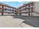 Aerial showing the apartment building and its parking lot at 590 N Logan St # 210, Denver, CO 80203