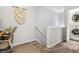 Stairway leading to the upper level with a small home office area at 82 Harlan St # B, Denver, CO 80226