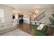 Open concept dining room with hardwood floors and chandelier at 776 N Yantley St, Aurora, CO 80018