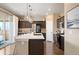 Kitchen boasts an island, stainless steel appliances, and white cabinets at 776 N Yantley St, Aurora, CO 80018