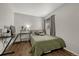 Bright bedroom with a comfortable bed and built-in workspace at 970 S Dawson Way # 10, Aurora, CO 80012