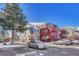 Exterior of the building with parking and landscaping at 970 S Dawson Way # 10, Aurora, CO 80012