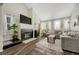 Living room with gas fireplace, hardwood floors, and a sectional sofa at 970 S Dawson Way # 10, Aurora, CO 80012
