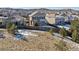 Aerial view of house and neighborhood with winter snow at 2090 Candleglow St, Castle Rock, CO 80109