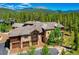 Luxury home with stone and wood exterior, three car garage at 327 Peerless Dr, Breckenridge, CO 80424