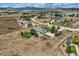 Aerial view showcasing a house, expansive yard, and neighborhood landscape at 4974 Malibu Dr, Berthoud, CO 80513