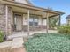 Front porch with stone facade and landscaping at 4974 Malibu Dr, Berthoud, CO 80513