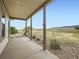 Covered patio with scenic views of open fields at 4974 Malibu Dr, Berthoud, CO 80513