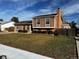 Ranch style home with brick and siding exterior, landscaped yard, and attached garage at 1680 Elmwood St, Broomfield, CO 80020