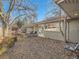 Backyard with patio and view of house exterior at 5931 E 6Th E, Denver, CO 80220