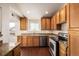 Kitchen boasts stainless steel appliances and granite countertops at 4608 Copeland Loop # 201, Highlands Ranch, CO 80126