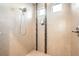 Large walk-in shower with tile surround and dual shower heads at 5580 Danube St, Denver, CO 80249