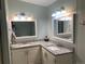 Updated bathroom with double vanity and granite countertops at 1103 Stage Dr, Fort Lupton, CO 80621