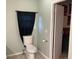 Simple bathroom with toilet and window for natural light at 1103 Stage Dr, Fort Lupton, CO 80621