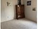 Spacious bedroom with carpeted floor and large wooden dresser at 1103 Stage Dr, Fort Lupton, CO 80621