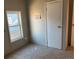 Bright bedroom with window, closet, and carpeted floor at 1103 Stage Dr, Fort Lupton, CO 80621