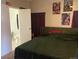 Cozy bedroom with a double bed, wall decor, and a desk at 1103 Stage Dr, Fort Lupton, CO 80621