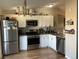 Well-equipped kitchen with white cabinets and granite countertops at 1103 Stage Dr, Fort Lupton, CO 80621