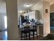 Kitchen with breakfast bar, stainless steel appliances, and granite counters at 1103 Stage Dr, Fort Lupton, CO 80621