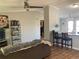 Open living space with a kitchen bar and hardwood floors at 1103 Stage Dr, Fort Lupton, CO 80621