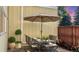 Cozy patio with seating for four and potted plants at 7445 W Maple Dr, Lakewood, CO 80226