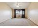 Large bedroom with ceiling fan, wall-to-wall carpet, and window at 585 S Alton Way # 4D, Denver, CO 80247