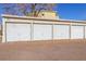 Exterior view of garage doors providing secure parking at 585 S Alton Way # 4D, Denver, CO 80247