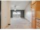 Spacious living room with ceiling fan and sliding glass door leading to balcony at 585 S Alton Way # 4D, Denver, CO 80247