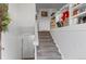 Interior view of a carpeted staircase with built-in shelving at 1320 Youngfield St, Golden, CO 80401