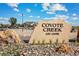 Stone sign marking the entrance to Coyote Creek Golf Course with parking area visible at 2204 Alyssa St, Fort Lupton, CO 80621