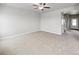 Spacious living room with neutral carpet and a ceiling fan at 2204 Alyssa St, Fort Lupton, CO 80621