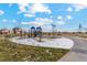 Community playground with play structures and swings at 2204 Alyssa St, Fort Lupton, CO 80621