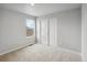 Bright bedroom with window and double doors at 2204 Alyssa St, Fort Lupton, CO 80621