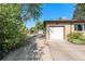 Attached garage with driveway access to the backyard at 5183 W Columbia Pl, Denver, CO 80236