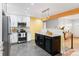 Modern kitchen with stainless steel appliances and granite countertops at 5183 W Columbia Pl, Denver, CO 80236