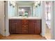 Double vanity bathroom with a large mirror and plenty of cabinet space at 2272 Cherry St, Denver, CO 80207