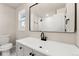 Updated bathroom with vanity, toilet, and shower at 5535 W Indore Dr, Littleton, CO 80128