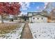 Updated Ranch home with snow covered yard, freshly painted exterior and landscaping at 5535 W Indore Dr, Littleton, CO 80128